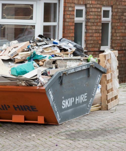 Street side skip filled with rubish